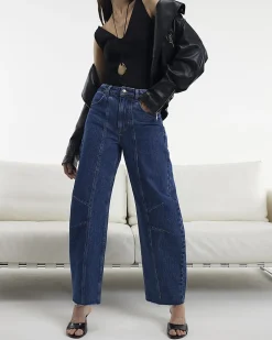 Blue Mid Rise Seamed Raw Hem Barrel Jeans