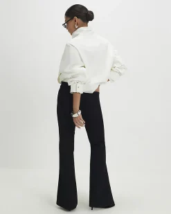 Petite Black High Rise Relaxed Flare Jeans